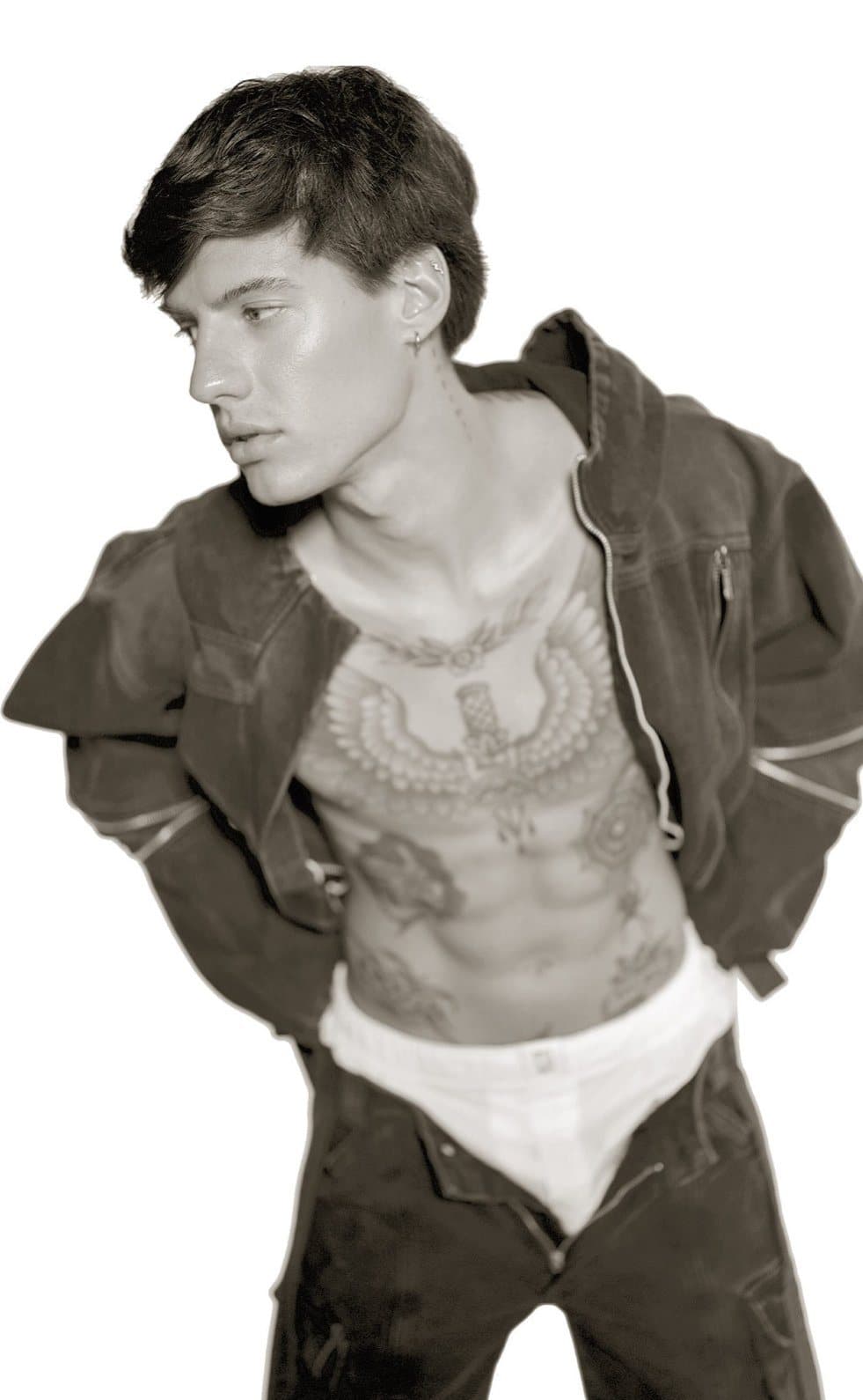 Black and white photograph of a design by Paloma Balvin — model in an open utility jacket