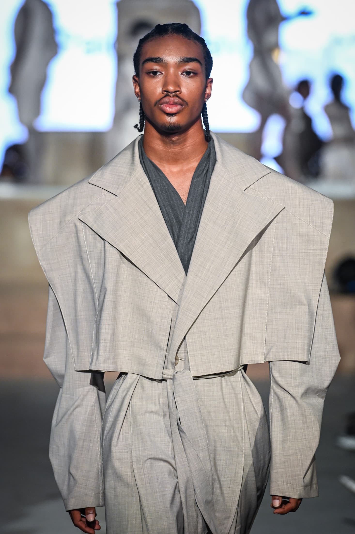 Close view of the greige cropped jacket's exaggerated shoulder and lapel — Miami Design District